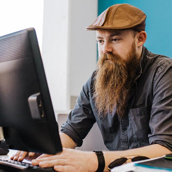 Man typing on computer